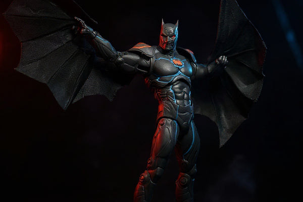 Black fabric cape with wire edges draped over an armored Batman-style 7-inch figure in a Batcave diorama with red and blue LED lighting and smoke.