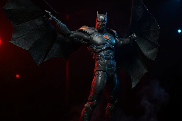 Black fabric cape wings with wire edges on armored Batman figure in Batcave diorama with red and blue lighting and fog.