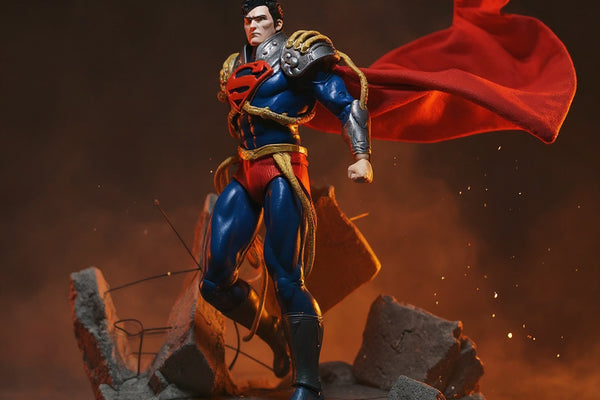 Deep red fabric cape with gold trim on action figure, dramatic city backdrop, red and yellow lighting.