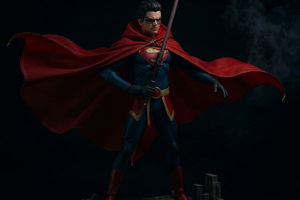 Dynamic deep red fabric cape with wired edges, posed on a display stand against a foggy gothic cityscape backdrop.