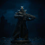 Matte black wired fabric trench coat on Batman action figure against Gotham cityscape backdrop, dramatic lighting.