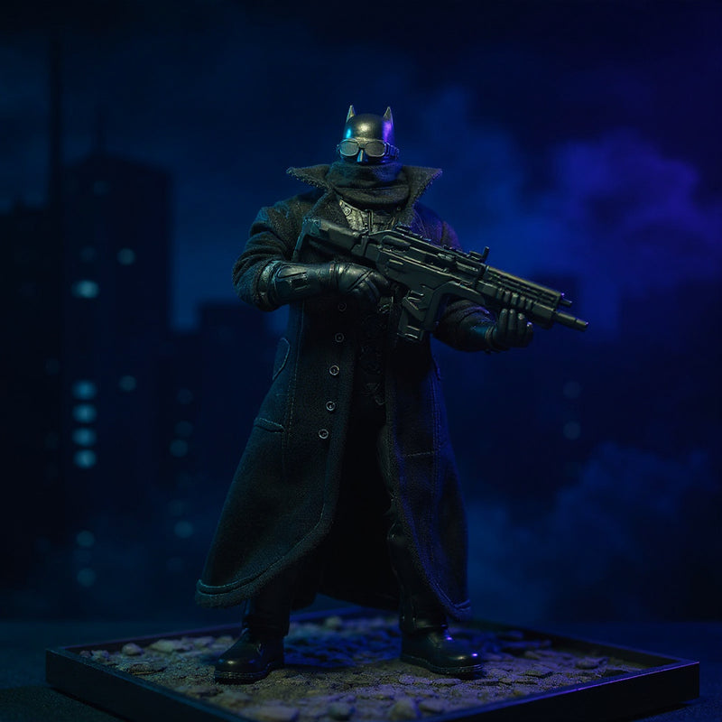 Matte black textured fabric trench coat with bendable wire edges draped on a dark-armored Batman-style action figure on a rooftop diorama with gothic cityscape and dramatic spotlighting.