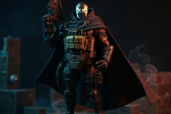 Dark tactical fabric cape and cloak on action figure in rooftop diorama with LED spotlight and fog.
