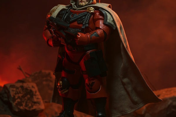 Dark red-black wired cape on a 7-inch figure in a hellscape diorama with red ambient lighting and rocky terrain.