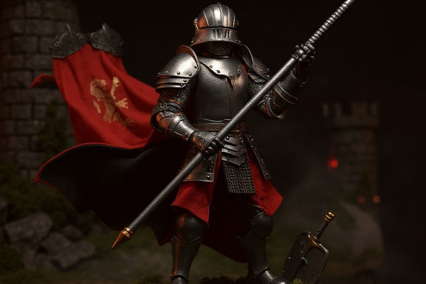Red and black wired cape on armored knight figure in a dramatic castle diorama with fog and LED lighting.
