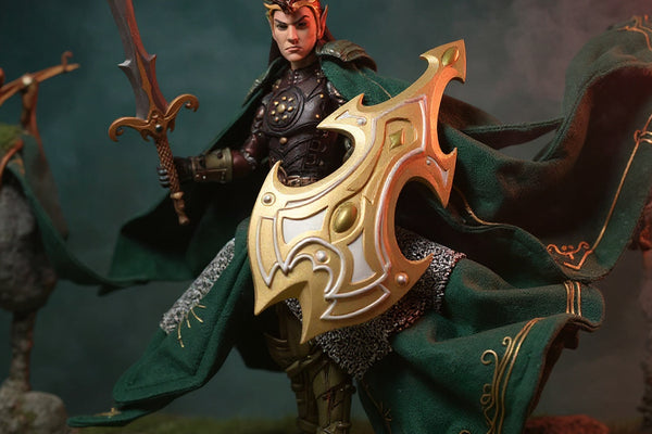 Dark green and brown woven fabric cape draped over a small action figure, in a fantasy forest diorama with moss, rocks, bow, and mist on a bold gradient background.
