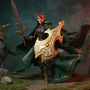 Dark green and brown woven fabric cape draped over a small action figure, in a fantasy forest diorama with moss, rocks, bow, and mist on a bold gradient background.