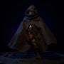 Tattered dark gray-brown fabric cloak draped over action figure torso on a moonlit gothic rooftop diorama, with rat figurines and dramatic side lighting.