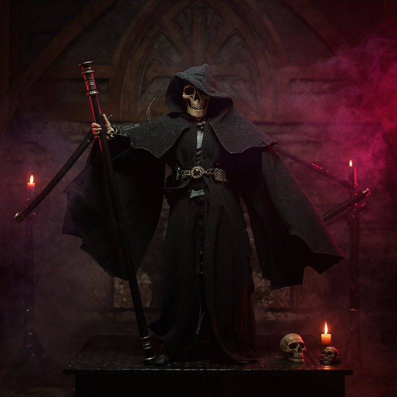 Dark textured fabric cape with wire support draped on a stand amid gothic props under dramatic red-purple lighting.