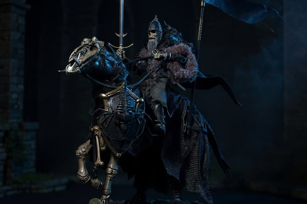 Dark tattered cloth cape with wire-shaped folds draped on a small articulated figure body, set against medieval castle ruins with sword, shield, fog, moonlit base, and banner.