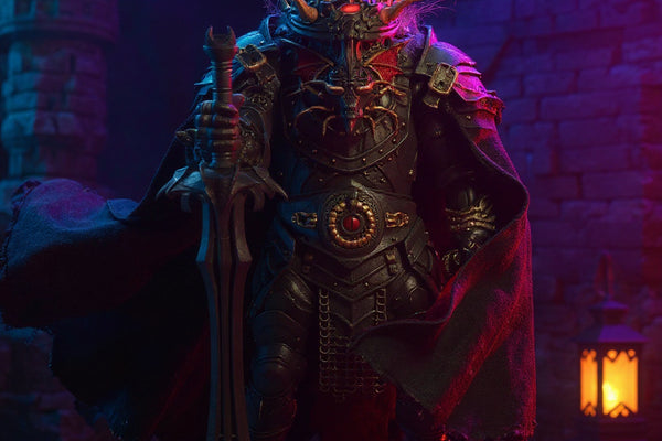 Dark textured cloak on a 9-inch figure against a stone castle and lantern, bold gradient background.