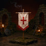 Small fabric crusader war banner on thin pole in miniature castle ruins with sword, shield and torch lighting