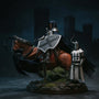 Custom wired fabric cape in deep blue draped over an armored knight figure, against a castle backdrop with mist.