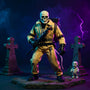 Tan jumpsuit on a posable skeleton figure in foggy graveyard diorama with proton pack and ghost accent, against bold blue-purple gradient.