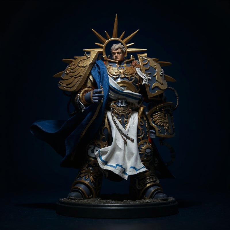 Deep blue fabric cloak with gold trim on an action figure torso, displayed on a ruins base with dramatic spotlight against a dark gradient background.