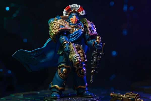 Small blue fabric cape for 1/18 action figure displayed on armor stand in sci-fi setting.