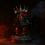 Tattered black fabric cape with internal wire draped over a miniature armor figure in dark stone ruins with red-orange dramatic lighting