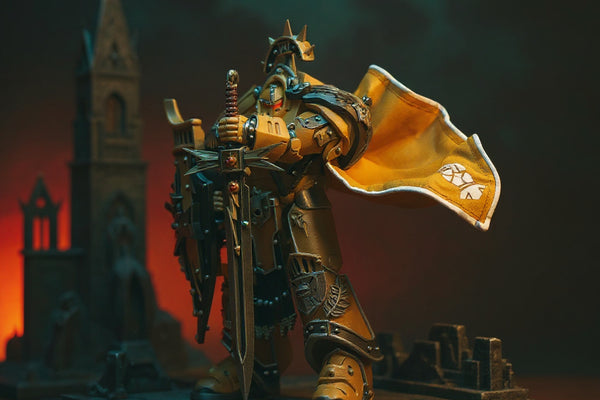 Handmade matte yellow cloth cape with black trim on dark grey Terminator figure in gothic ruins diorama under grimdark LED lighting.