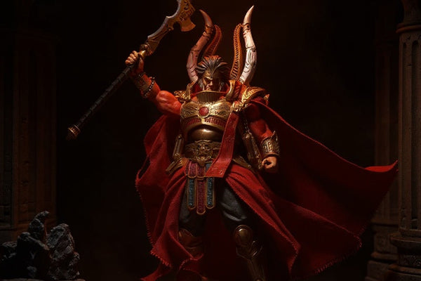 Rich crimson-red wire-framed cape on an action figure torso, set against a dark stone battlefield diorama with dramatic red lighting and smoke effects.