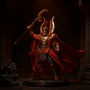 Rich crimson-red wire-framed cape on an action figure torso, set against a dark stone battlefield diorama with dramatic red lighting and smoke effects.