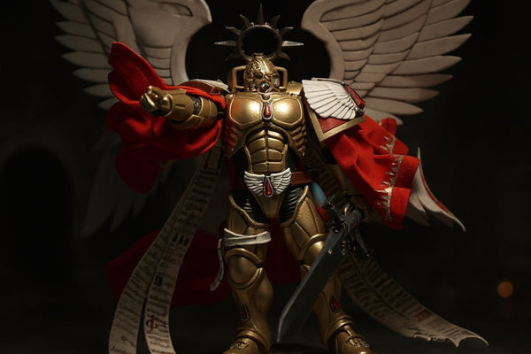Golden and crimson fabric cape with wire frame displayed on a ruined cathedral diorama base with dramatic lighting.