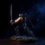 Dark fabric ninja scarf with wire shaping on rocky diorama with miniature katana and shuriken, moonlit dojo backdrop.