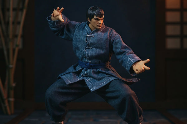 Blue 1/12 scale traditional Chinese kung fu outfit with mandarin collar and sash draped on articulated action figure in dojo scene