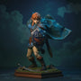 Hero image of a Zelda TotK soft goods cloak in blue-green fabric, dynamically posed with wire-shaped folds, draped over an armor torso on a Hyrule-themed diorama base with rocks, moss, and Master Sword, under dramatic blue-hour lighting.