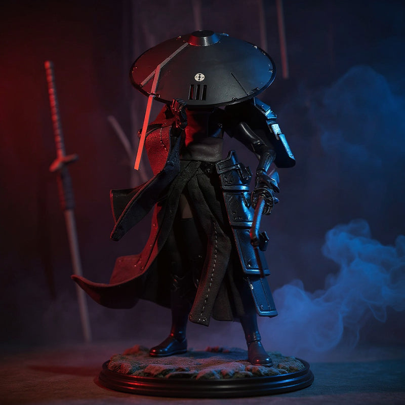 Dark textured fabric cloak with wired folds draped on a 1/12 scale action figure in a dramatic dojo with wooden katana and misty fog.