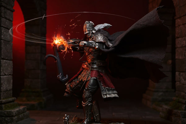 Dark brownish-gray weathered cloth cape on action figure torso in fantasy stone ruins with dramatic lighting
