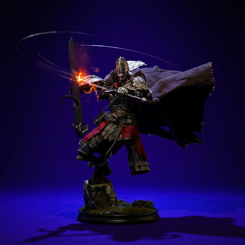 Dark brownish-gray frayed fabric cape with wire frame draped on action figure torso against bold blue-violet gradient backdrop.