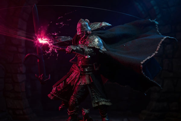 Dark tattered cloak with internal wire frame displayed in dramatic fantasy ruins under vibrant colored lighting.
