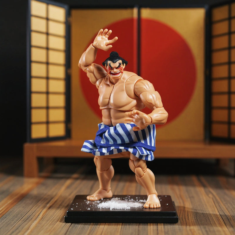 Small blue cloth mawashi belt on 1/12 scale action figure torso displayed on miniature sumo ring with salt scatter and folding screen