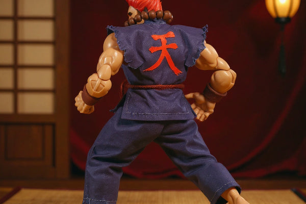 Tattered dark red and grey karate gi on a small action figure in mid-kick under moody dojo lighting with tatami and lantern.