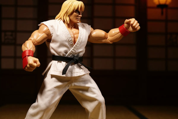 White 1/12 scale karate gi with red trim and cloth sash on headless figure mannequin in dojo with wooden floor, shoji screen, and dramatic red-black lighting.