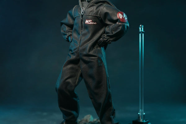 Dark tactical protective suit on headless 1/12 action figure body displayed on urban rubble diorama with LED glow and gradient background.