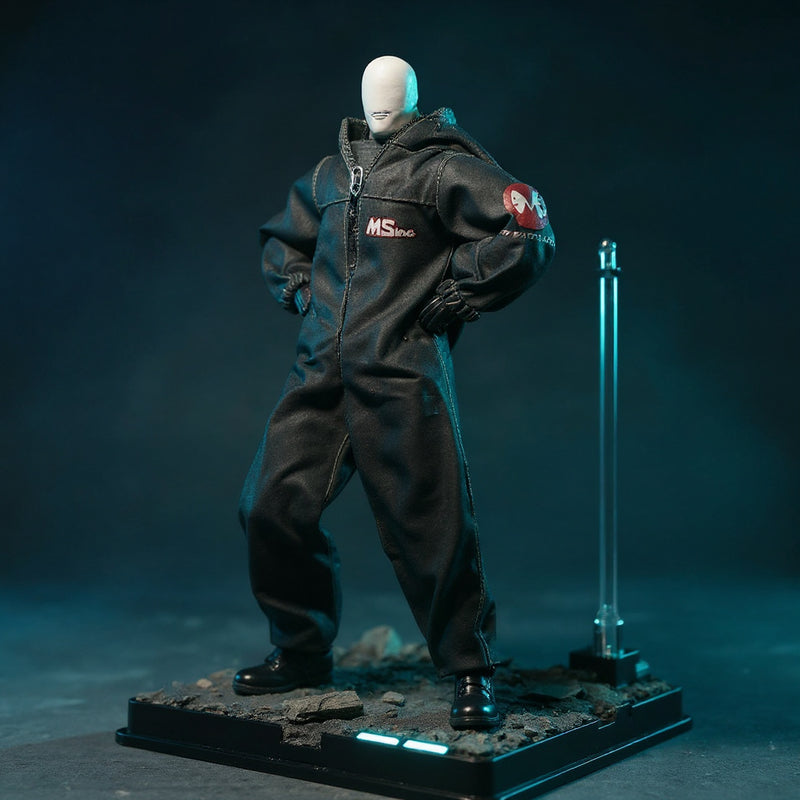 Dark tactical protective suit on headless 1/12 action figure body displayed on urban rubble diorama with LED glow and gradient background.