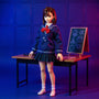 Navy blue and white 1/12 scale school uniform outfit on a headless action figure body, displayed at a miniature classroom desk with chalkboard and backpack, bold gradient background.
