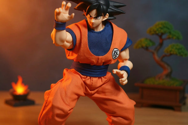 1/12 scale handmade Goku gi cloth outfit on an action figure with wooden dojo backdrop and blue energy effect