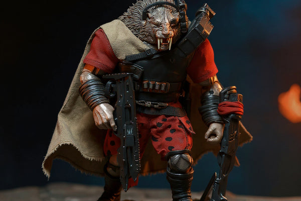 Flowing earthy brown fabric cape on gladiator action figure torso in a stone arena with weapons and mossy wooden base under dramatic side lighting.