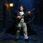 Black fabric trench coat with hand-stitching on action figure in dynamic pose under urban alley rain with street lamp