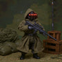 Tactical 1/12 scale fabric jacket displayed in miniature military diorama with sandbags and crates.
