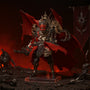 Dark crimson-red and bronze textured cloth cape with visible folds draped on a small display stand, miniature battlefield backdrop with weapons and chaos banner, red and black ambient lighting.