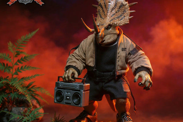 Close-up of textured fabric clothing on a 1/12 scale ceratopsian dinosaur figure in prehistoric diorama with wire-edged folds and stitching.