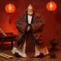 Traditional Chinese scholar robe on action figure body with scholar desk, scroll, lantern, and incense burner against a bold crimson gradient background.