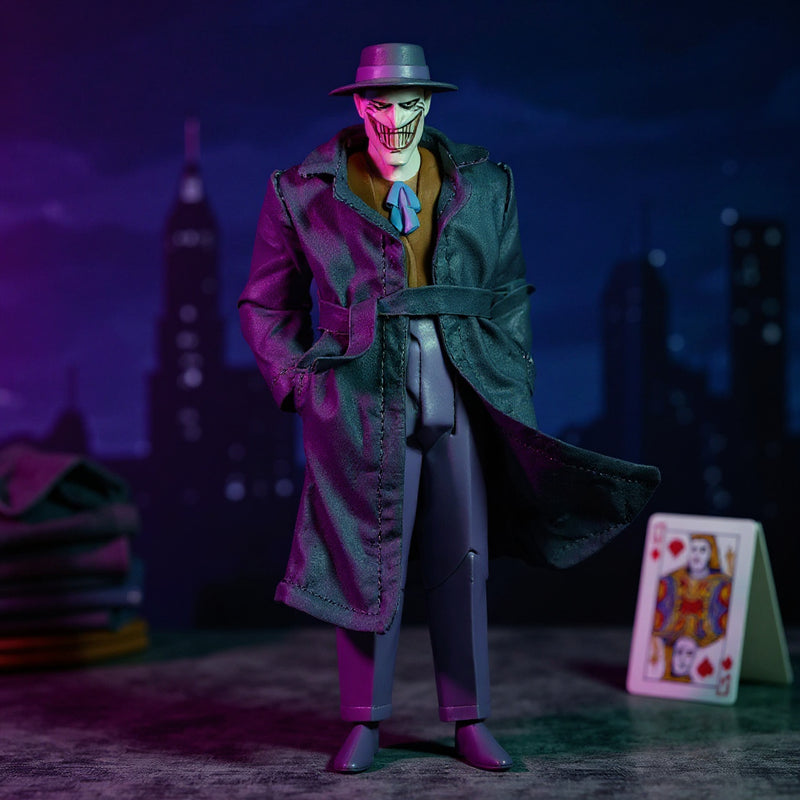 Dark grey or purple fabric trench coat for 7-inch action figure flat-laid on miniature Gotham rooftop with playing card and fabric swatches, dramatic purple and green lighting.