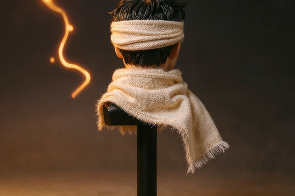 Cream soft goods scarf with visible wire draped over a miniature action figure neck stand, against a bold gradient backdrop with Hamon energy light effects.