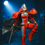 Ultraman Seven style figure wearing a dark fabric cape with internal wire frame, posed dynamically against a city skyline backdrop with dramatic spotlight and wind-blown cape effect.