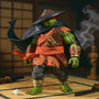Dark green ninja cape draped over TMNT-style action figure in dynamic pose with bamboo dojo backdrop, katana and shuriken props, and smoke effect